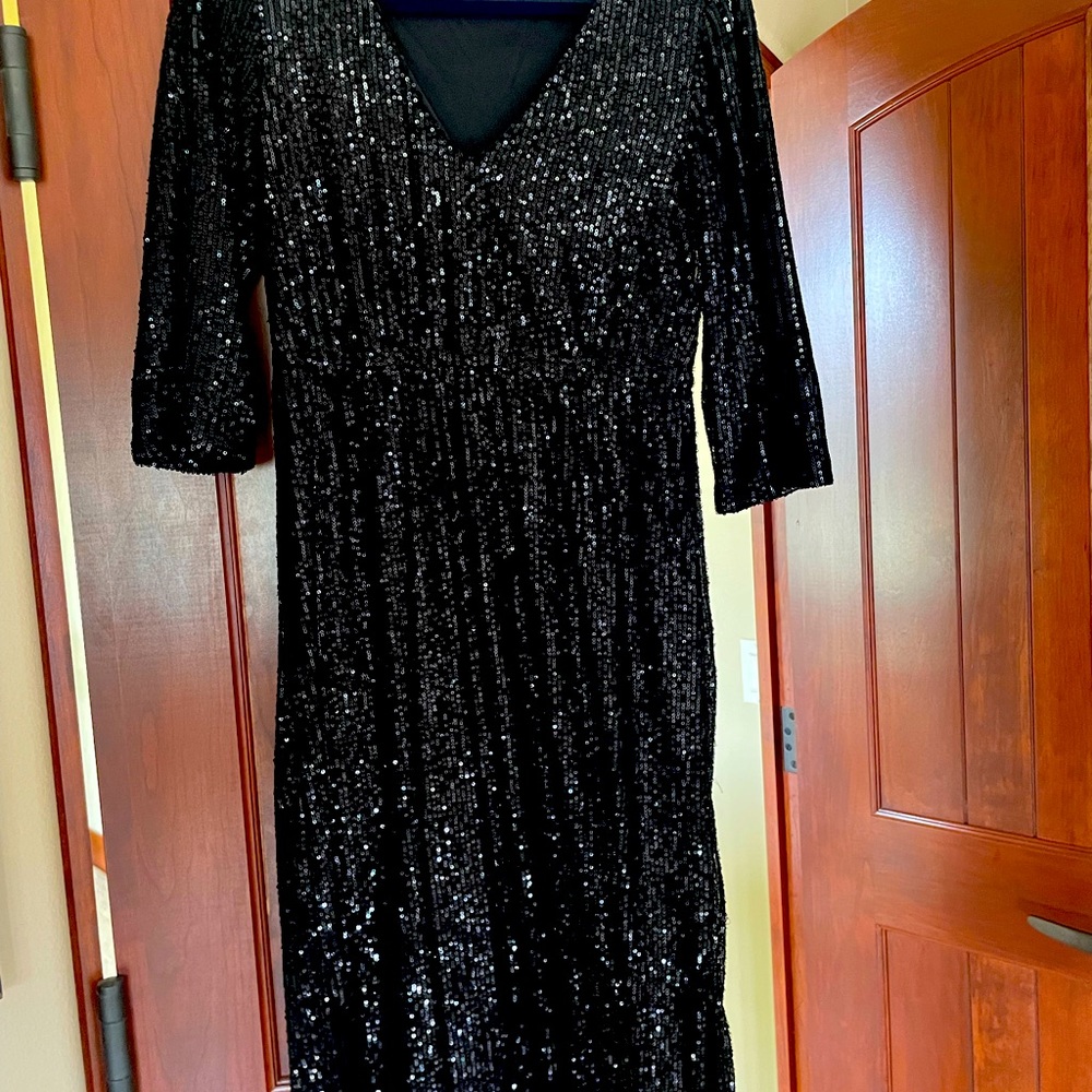 Black sequined V neck dress.